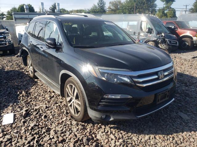 HONDA PILOT TOUR 2016 with VIN 5FNYF6H92GB097611 - Photo from auction