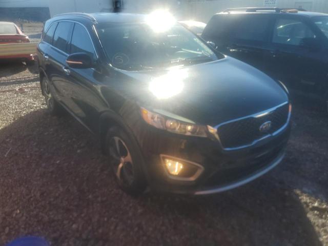 KIA SORENTO EX 2016 with VIN 5XYPH4A55GG185594 - Photo from auction