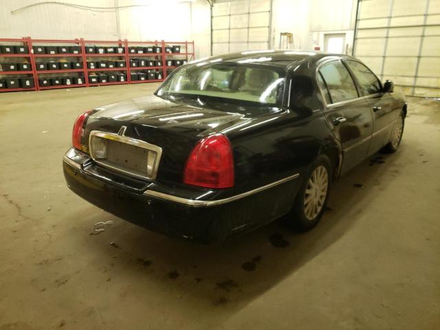 Photo 4 from auction – 2004 LINCOLN TOWN CAR E with VIN 1LNHM81W44Y623794