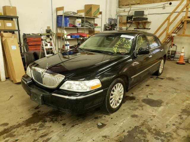 Photo 2 from auction – 2004 LINCOLN TOWN CAR E with VIN 1LNHM81W44Y623794