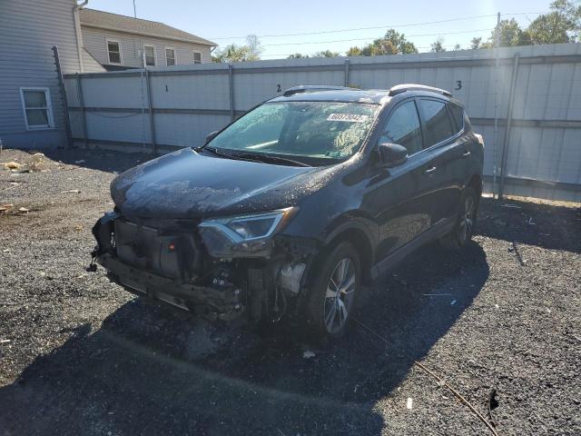 Photo 2 from auction – 2016 TOYOTA RAV4 XLE with VIN 2T3RFREV8GW460933