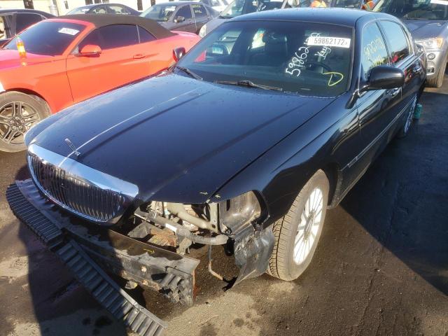 Photo 2 from auction – 2003 LINCOLN TOWN CAR E with VIN 1LNHM81W73Y660661