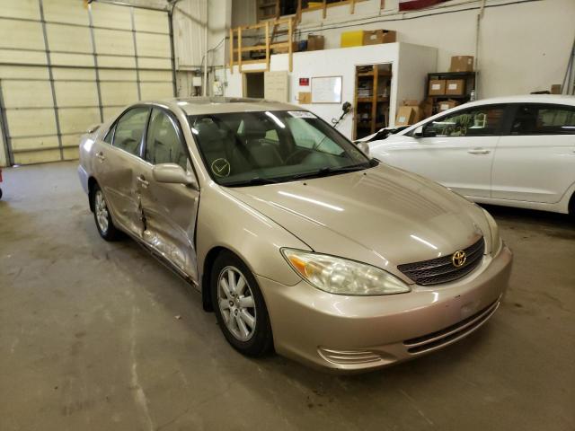 TOYOTA CAMRY LE 2002 with VIN 4T1BF30K62U014874 - Photo from auction