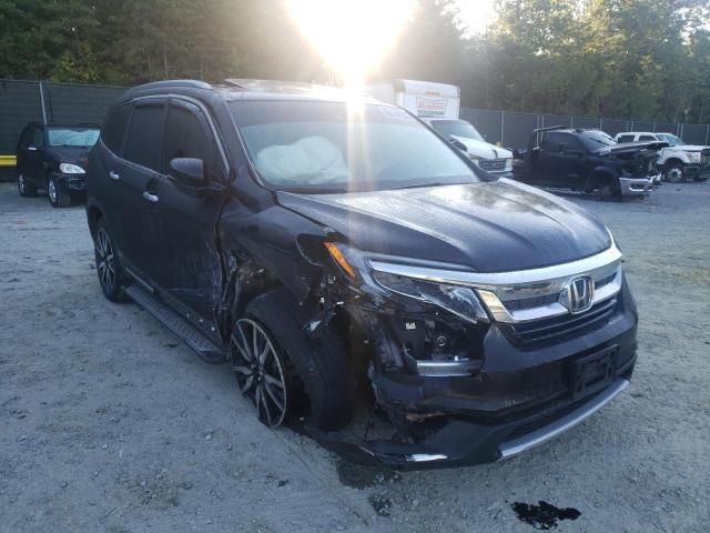 HONDA PILOT TOUR 2019 with VIN 5FNYF6H98KB091997 - Photo from auction