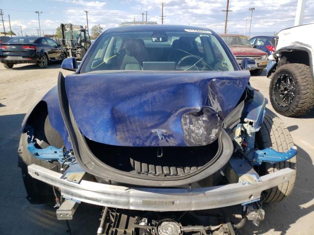 Photo 5 from auction – 2022 TESLA MODEL 3 with VIN 5YJ3E1EA8NF143809