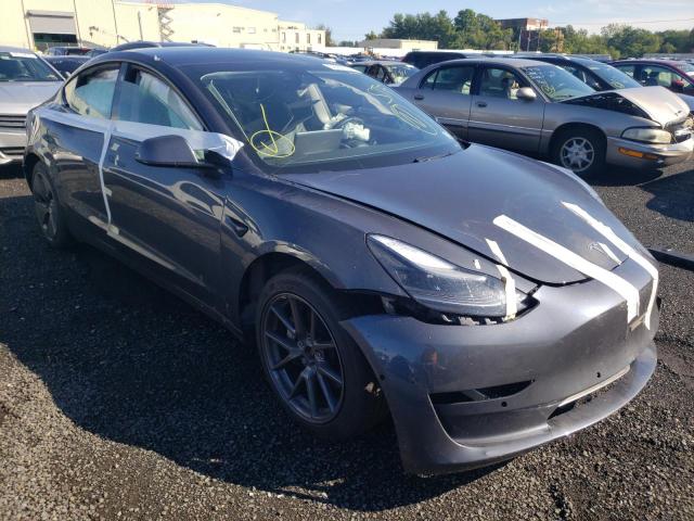 TESLA MODEL 3 2021 with VIN 5YJ3E1EB9MF902460 - Photo from auction