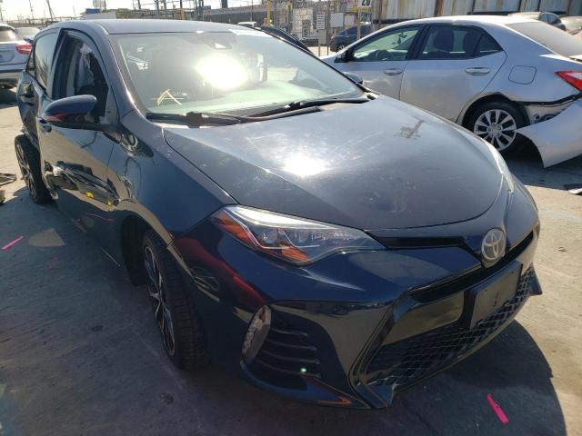TOYOTA COROLLA L 2018 with VIN 5YFBURHE4JP779282 - Photo from auction