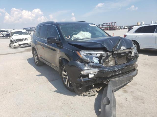HONDA PILOT TOUR 2016 with VIN 5FNYF5H91GB042383 - Photo from auction