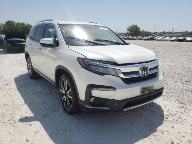 HONDA PILOT TOUR 2019 with VIN 5FNYF5H63KB011604 - Photo from auction