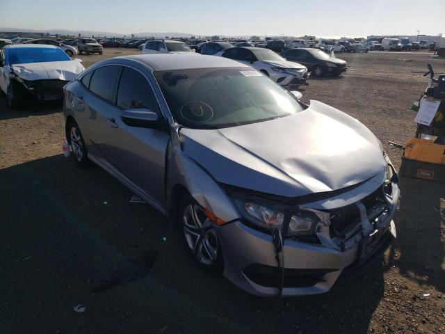 HONDA CIVIC LX 2018 with VIN 19XFC2E55JE001378 - Photo from auction