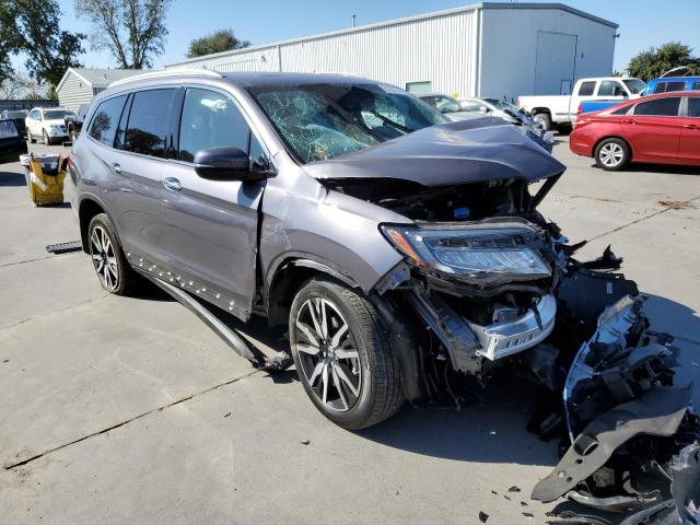 HONDA PILOT TOUR 2022 with VIN 5FNYF6H95NB016971 - Photo from auction