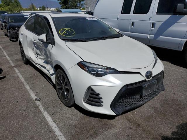 TOYOTA COROLLA L 2018 with VIN 5YFBURHE0JP738292 - Photo from auction
