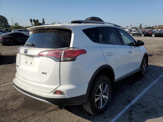 Photo 4 from auction – 2016 TOYOTA RAV4 XLE with VIN JTMWFREV0GJ060947