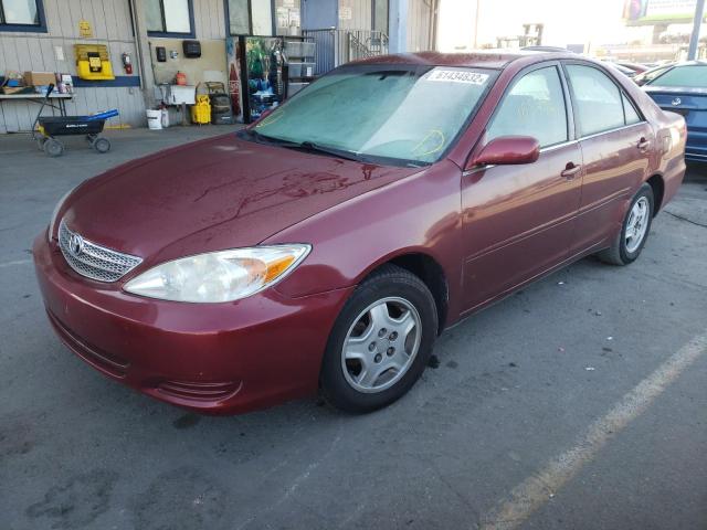 Photo 2 from auction – 2002 TOYOTA CAMRY LE with VIN JTDBE32K520043813