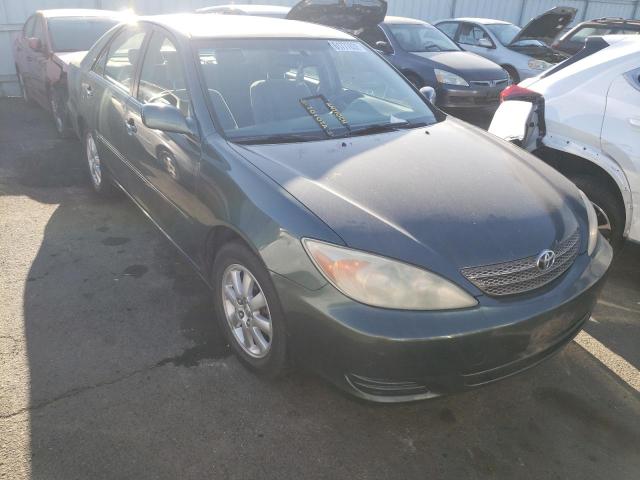 TOYOTA CAMRY LE 2002 with VIN JTDBE30K320121959 - Photo from auction