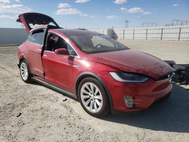 TESLA MODEL X 2018 with VIN 5YJXCAE2XJF107890 - Photo from auction