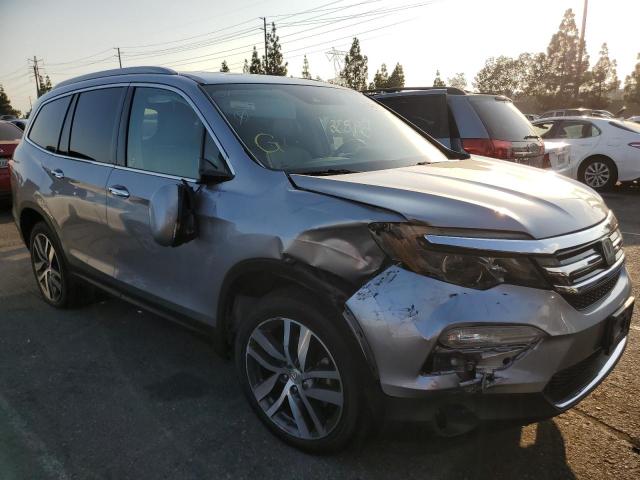 HONDA PILOT TOUR 2017 with VIN 5FNYF5H96HB030943 - Photo from auction