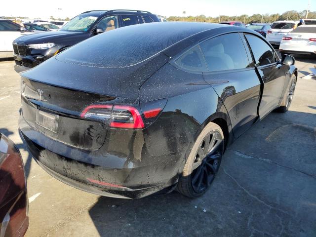 Photo 4 from auction – 2021 TESLA MODEL 3 with VIN 5YJ3E1EAXMF080985