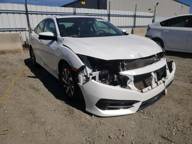 HONDA CIVIC EX 2018 with VIN 19XFC2F73JE042298 - Photo from auction