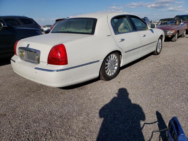 Photo 4 from auction – 2004 LINCOLN TOWN CAR E with VIN 1LNHM81W94Y654359