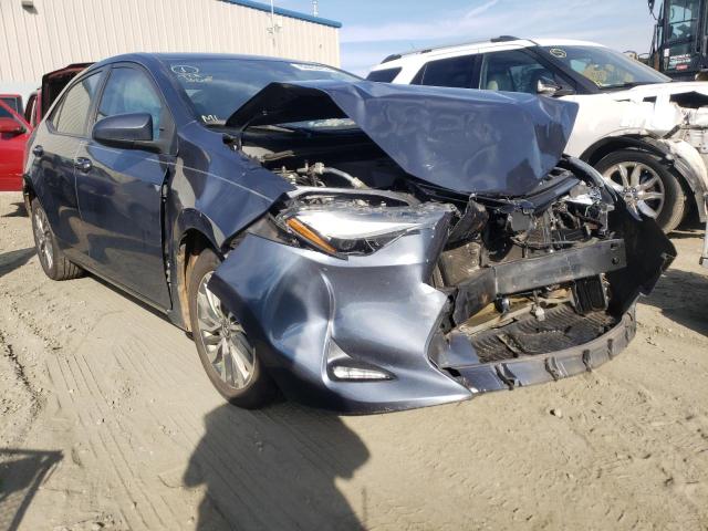 TOYOTA COROLLA L 2017 with VIN 5YFBURHE1HP658896 - Photo from auction