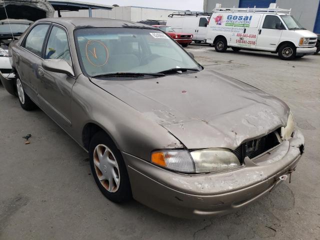 MAZDA 626 DX 1998 with VIN 1YVGF22C1W5740694 - Photo from auction