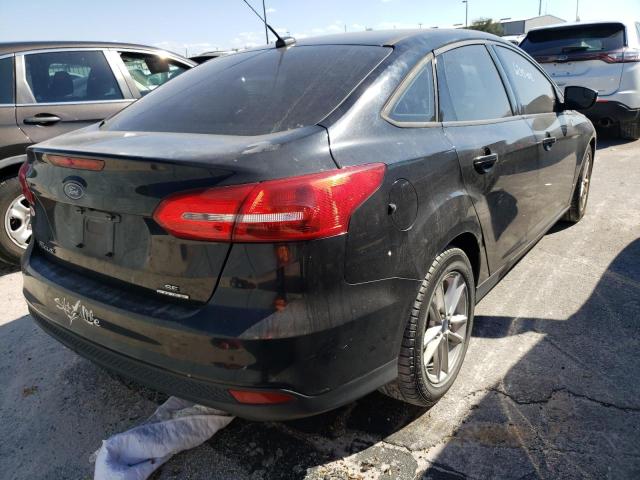 Photo 4 from auction – 2016 FORD FOCUS SE with VIN 1FADP3F24GL216729