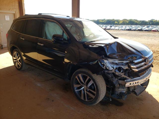 HONDA PILOT TOUR 2017 with VIN 5FNYF6H99HB047452 - Photo from auction
