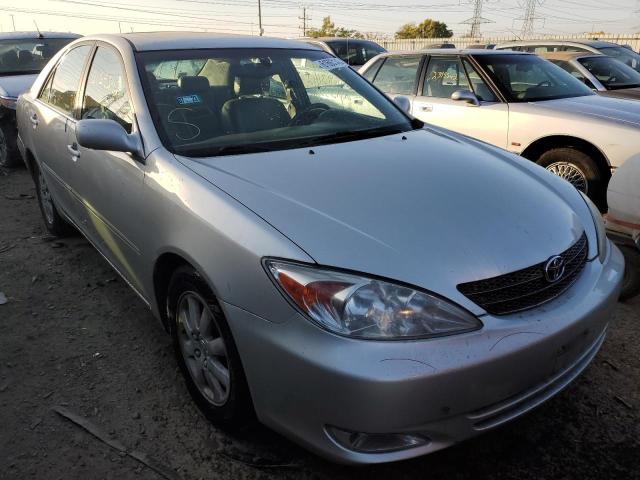 TOYOTA CAMRY LE 2003 with VIN 4T1BF30K23U562503 - Photo from auction