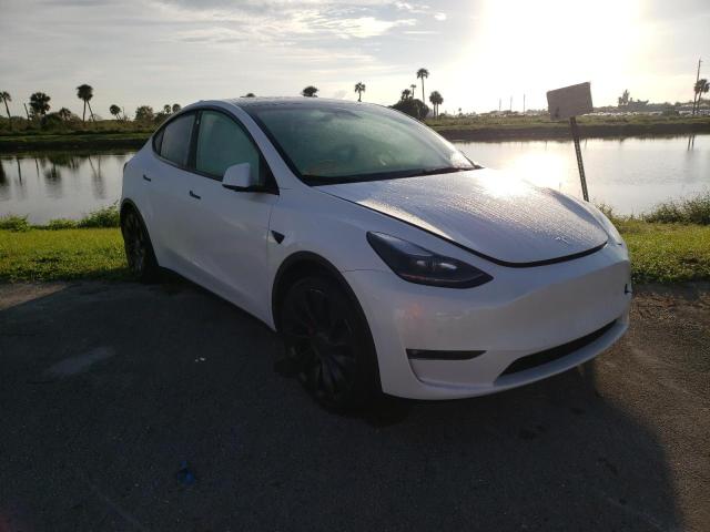 TESLA MODEL Y 2022 with VIN 7SAYGDEF3NF326163 - Photo from auction