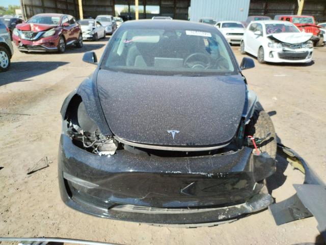 Photo 5 from auction – 2021 TESLA MODEL 3 with VIN 5YJ3E1EA4MF095336