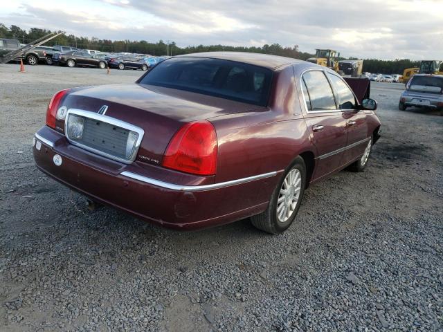 Photo 4 from auction – 2004 LINCOLN TOWN CAR E with VIN 1LNHM81W54Y685043