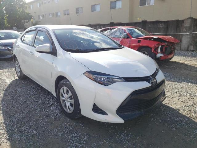 TOYOTA COROLLA LE 2018 with VIN 5YFBPRHE7JP771295 - Photo from auction