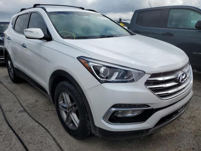 HYUNDAI SANTA FE S 2018 with VIN 5NMZU3LB8JH101458 - Photo from auction