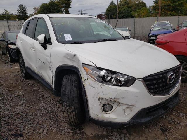 MAZDA CX-5 GT 2016 with VIN JM3KE4DY7G0902275 - Photo from auction