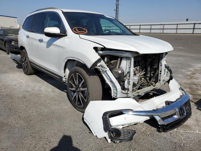 HONDA PILOT TOUR 2021 with VIN 5FNYF6H66MB039504 - Photo from auction