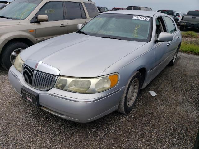 Photo 2 from auction – 2002 LINCOLN TOWN CAR E with VIN 1LNHM81W22Y666236
