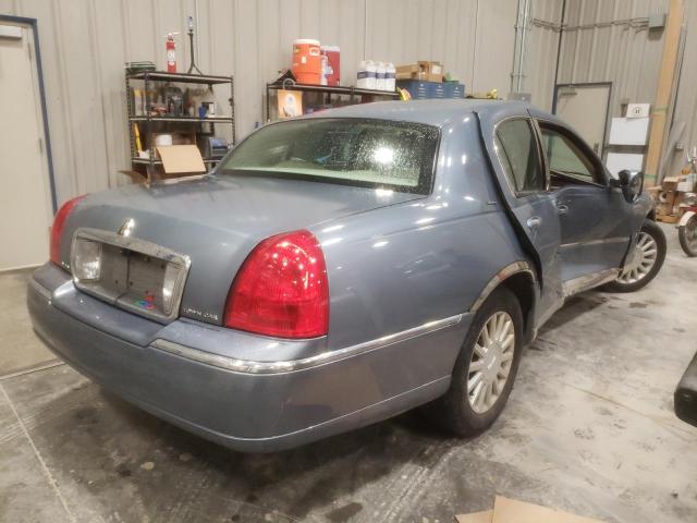Photo 4 from auction – 2003 LINCOLN TOWN CAR E with VIN 1LNHM81W83Y672558