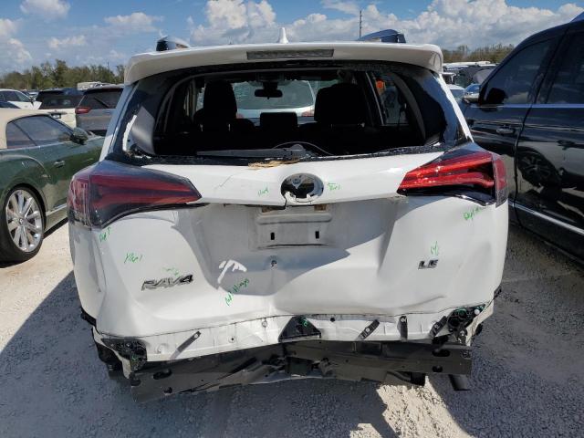 Photo 9 from auction – 2018 TOYOTA RAV4 LE with VIN JTMZFREV2JJ180754
