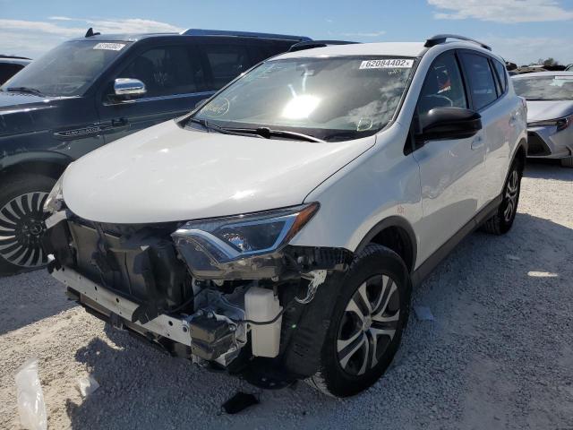 Photo 2 from auction – 2018 TOYOTA RAV4 LE with VIN JTMZFREV2JJ180754