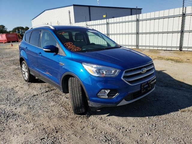 FORD ESCAPE TIT 2017 with VIN 1FMCU0J94HUD25006 - Photo from auction