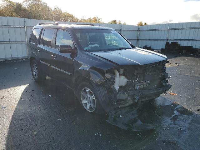 HONDA PILOT TOUR 2011 with VIN 5FNYF4H9XBB039324 - Photo from auction