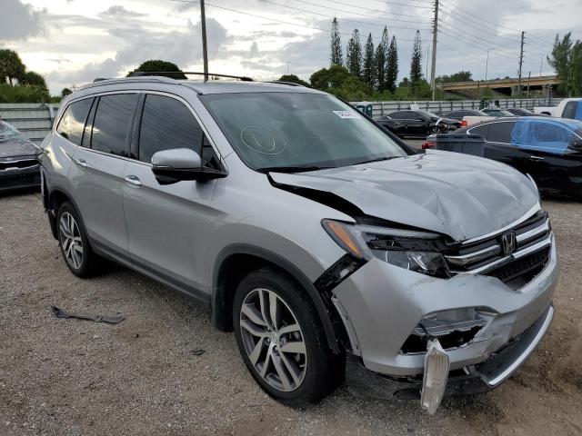 HONDA PILOT TOUR 2017 with VIN 5FNYF6H99HB035284 - Photo from auction