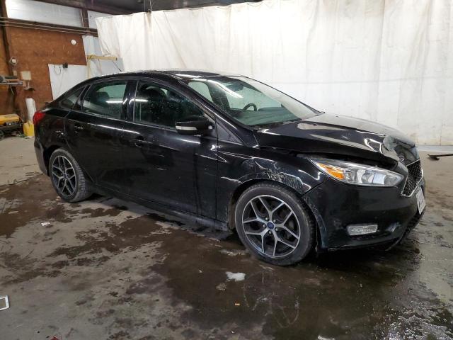 FORD FOCUS SE 2015 with VIN 1FADP3F26FL235197 - Photo from auction