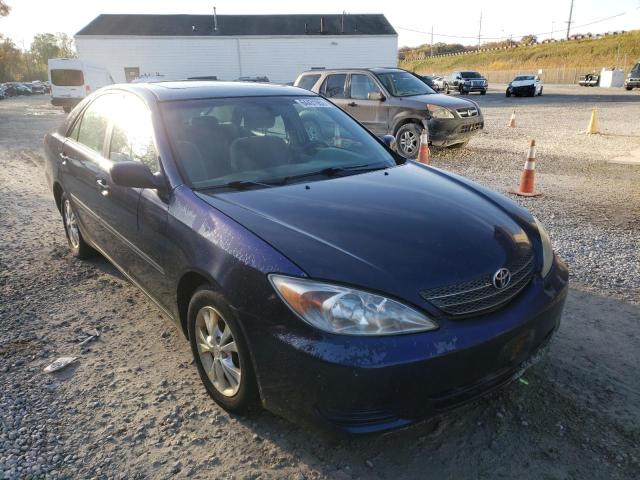 TOYOTA CAMRY LE 2004 with VIN 4T1BF30K74U077047 - Photo from auction