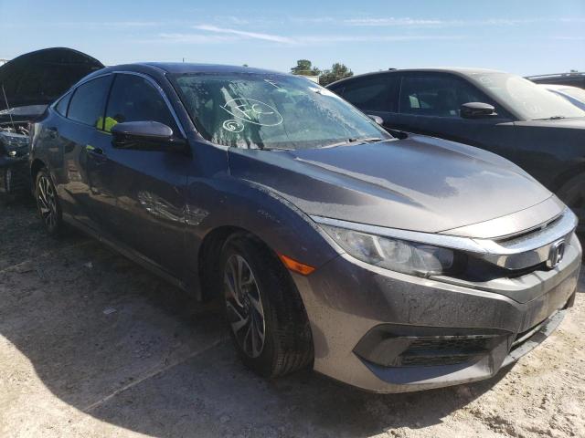 HONDA CIVIC EX 2018 with VIN 19XFC2F71JE029338 - Photo from auction