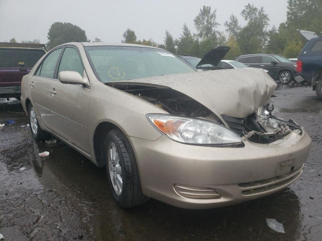 TOYOTA CAMRY L/LE 2002 with VIN JTDBE32K520098794 - Photo from auction