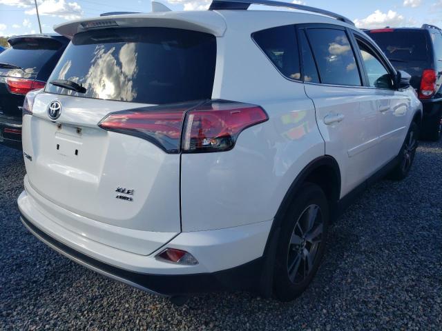 Photo 4 from auction – 2017 TOYOTA RAV4 XLE with VIN JTMRFREV9HJ710972