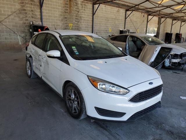 FORD FOCUS SE 2015 with VIN 1FADP3K26FL381881 - Photo from auction