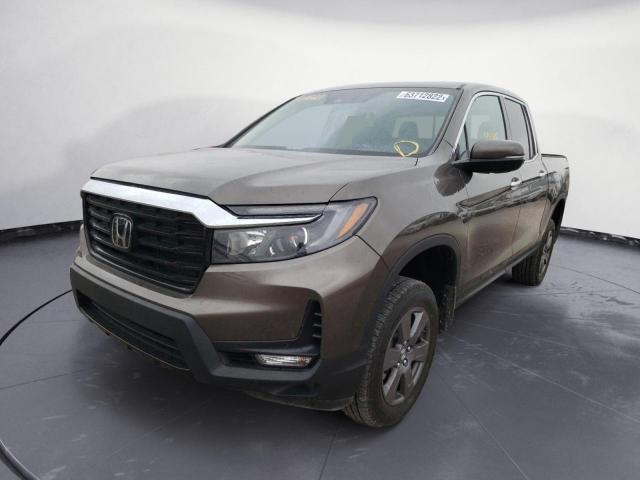 Photo 2 from auction – 2022 HONDA RIDGELINE with VIN 5FPYK3F74NB000473